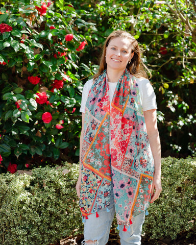 Add elegance with our unique floral and mosaic patterned scarf, adorned with red and blue tassels. Soft, lightweight, and comfortable for all-day wear. All scarves are a polyester blend. Add elegance with our unique floral and mosaic patterned scarf, adorned with red and blue tassels. Soft, lightweight, and comfortable for all-day wear. All scarves are a polyester blend.