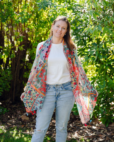 Add elegance with our unique floral and mosaic patterned scarf, adorned with red and blue tassels. Soft, lightweight, and comfortable for all-day wear. All scarves are a polyester blend. Add elegance with our unique floral and mosaic patterned scarf, adorned with red and blue tassels. Soft, lightweight, and comfortable for all-day wear. All scarves are a polyester blend.