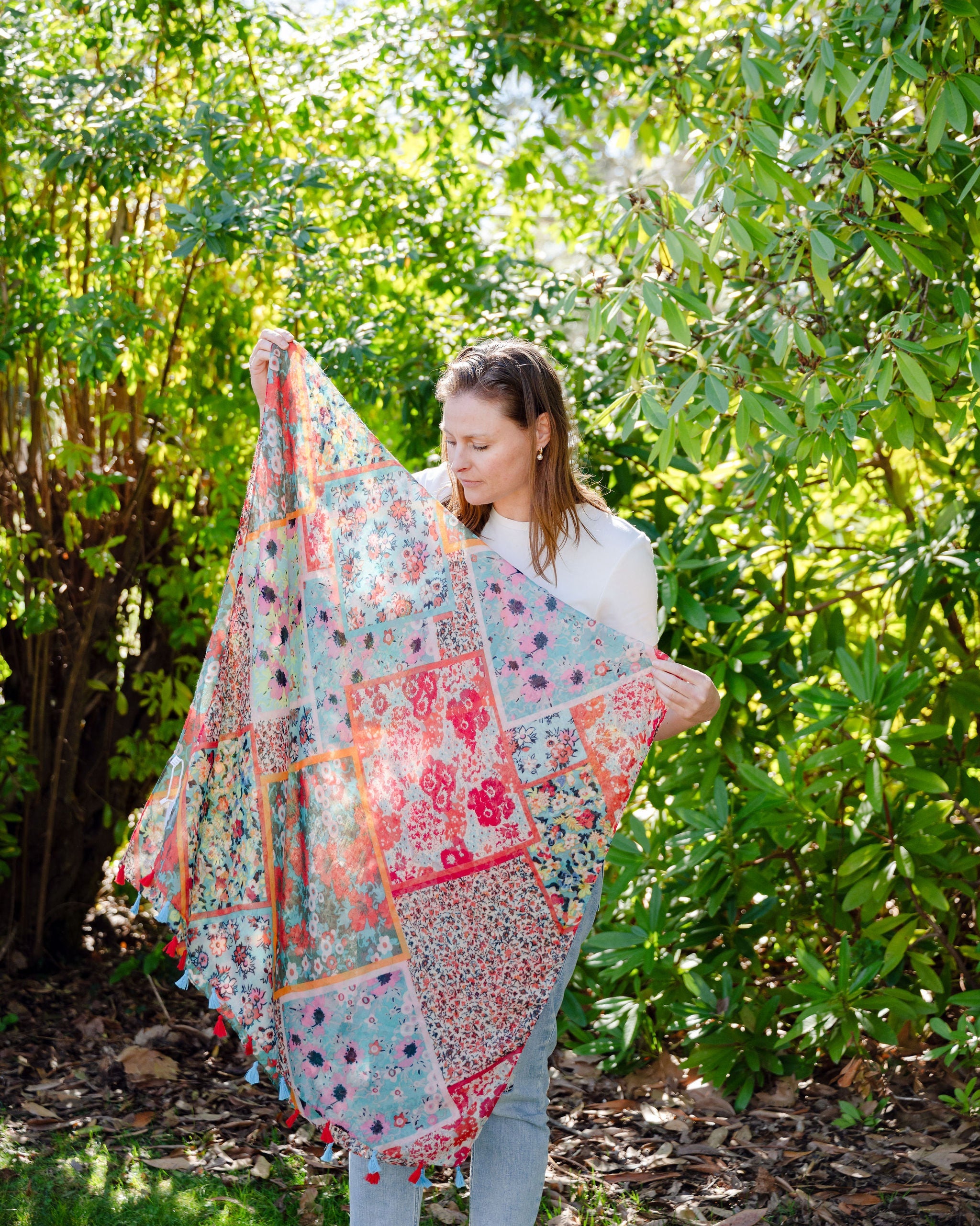 Add elegance with our unique floral and mosaic patterned scarf, adorned with red and blue tassels. Soft, lightweight, and comfortable for all-day wear. All scarves are a polyester blend. Add elegance with our unique floral and mosaic patterned scarf, adorned with red and blue tassels. Soft, lightweight, and comfortable for all-day wear. All scarves are a polyester blend.