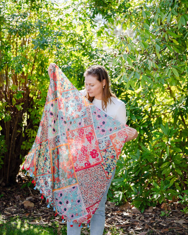Add elegance with our unique floral and mosaic patterned scarf, adorned with red and blue tassels. Soft, lightweight, and comfortable for all-day wear. All scarves are a polyester blend. Add elegance with our unique floral and mosaic patterned scarf, adorned with red and blue tassels. Soft, lightweight, and comfortable for all-day wear. All scarves are a polyester blend.