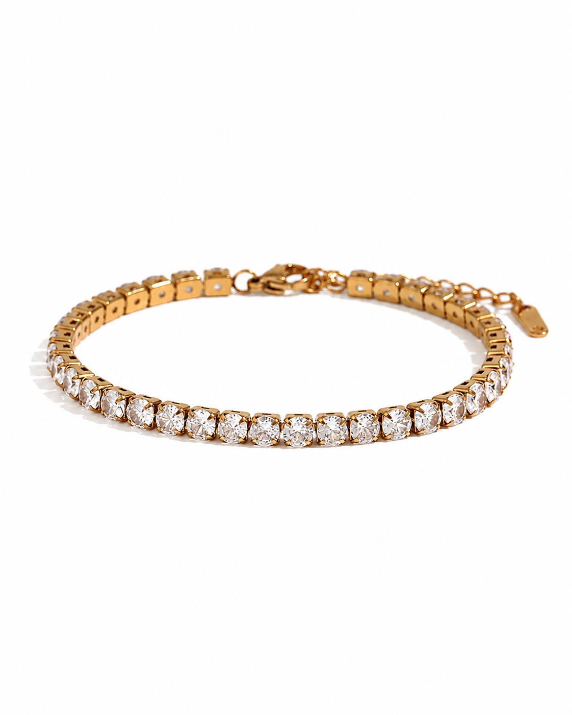 Gold tennis bracelet with a single row of round crystal stones, shown with clasp and length detail.