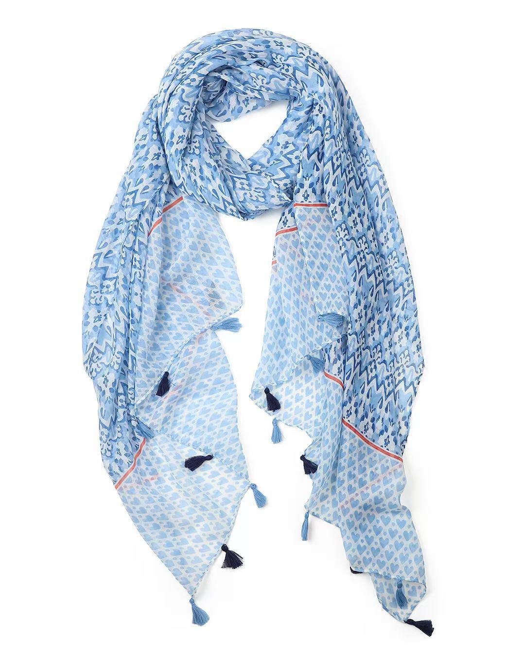 Blue ikat print and heart print lightweight scarf with red stripe and tassels