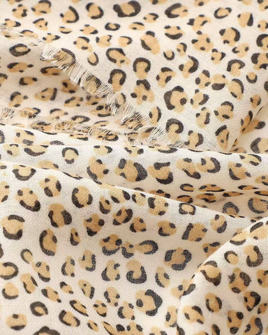 Close-up of tan and black mini leopard print scarf
