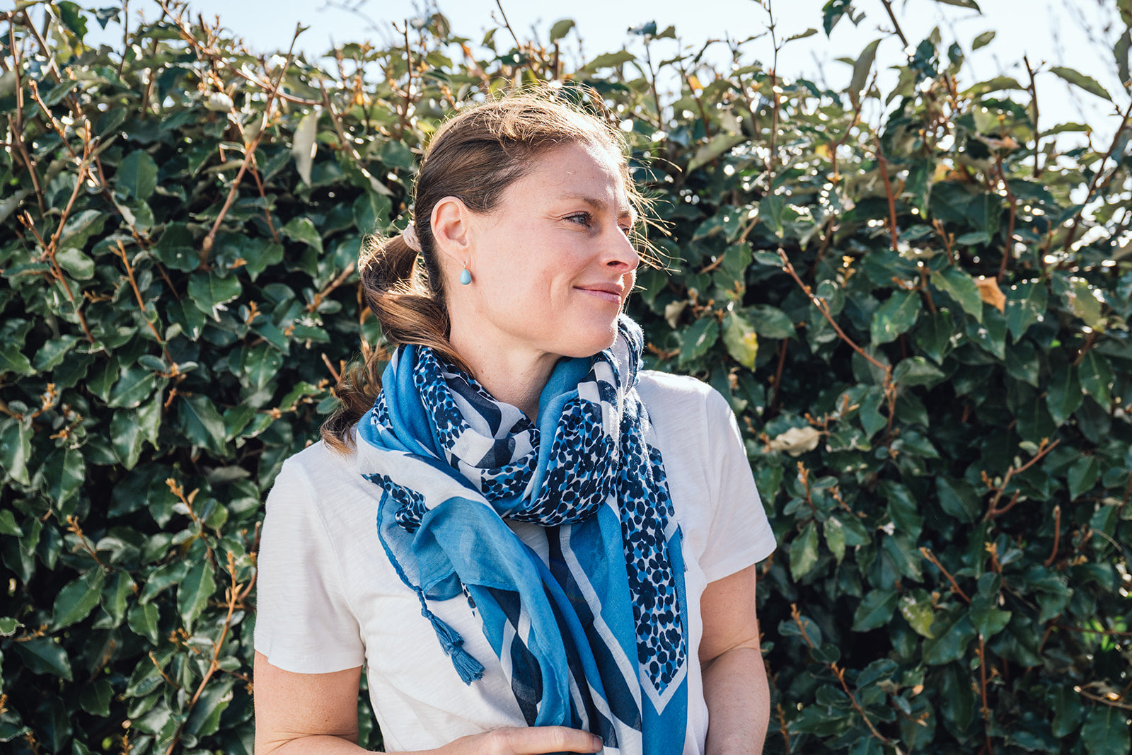 Introducing our geometric confetti spot scarf – the lightweight, year-round essential that's all about fun and fashion! Each corner is adorned with delightful tassels for added texture. Featuring a fantastic palette of navy, denim blues, and white, this scarf is as versatile as your favourite pair of jeans.