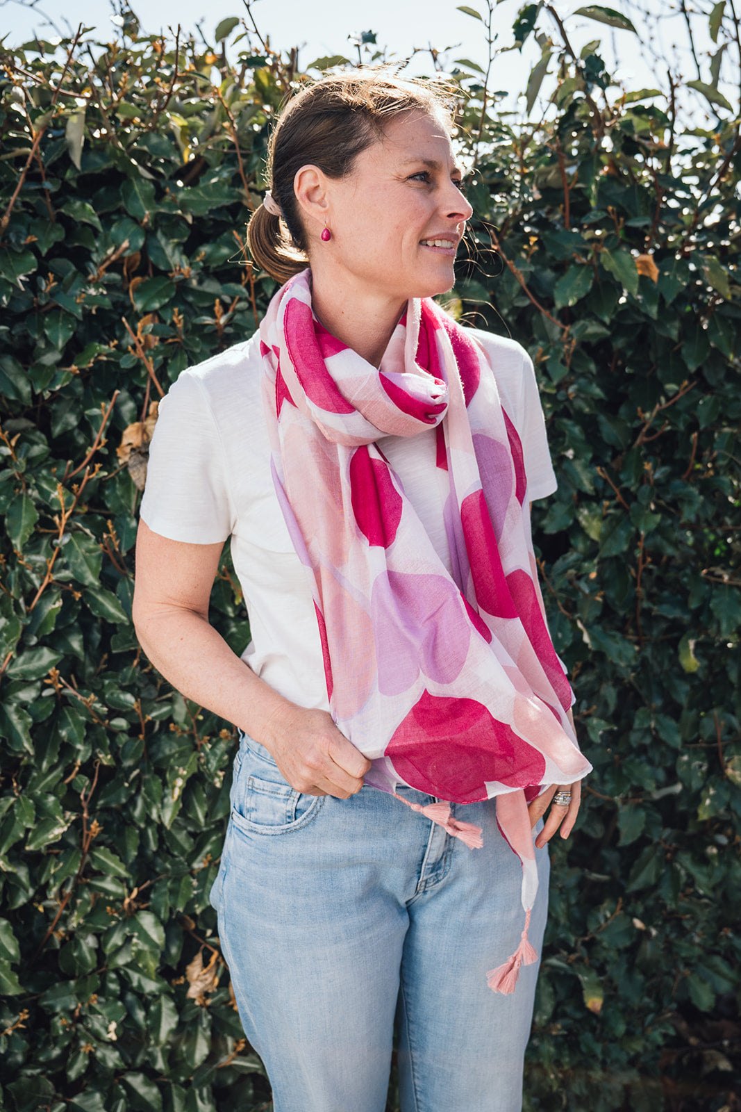 Fall in love with our Love Heart Scarf! It's lightweight, perfect for year-round wear, and features charming pink tassels on each corner for a little added texture. The white base adorned with pink and lilac hearts adds a touch of sweetness to any outfit. What's not to love!