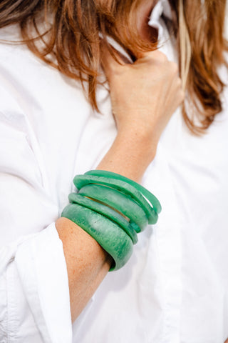 Stack of 5 green resin bangles