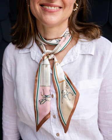 Satin neck scarf and bag tie in beige horse print styled around the neck