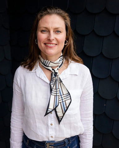 Satin neck scarf and bag tie in blue check print styled around the neck