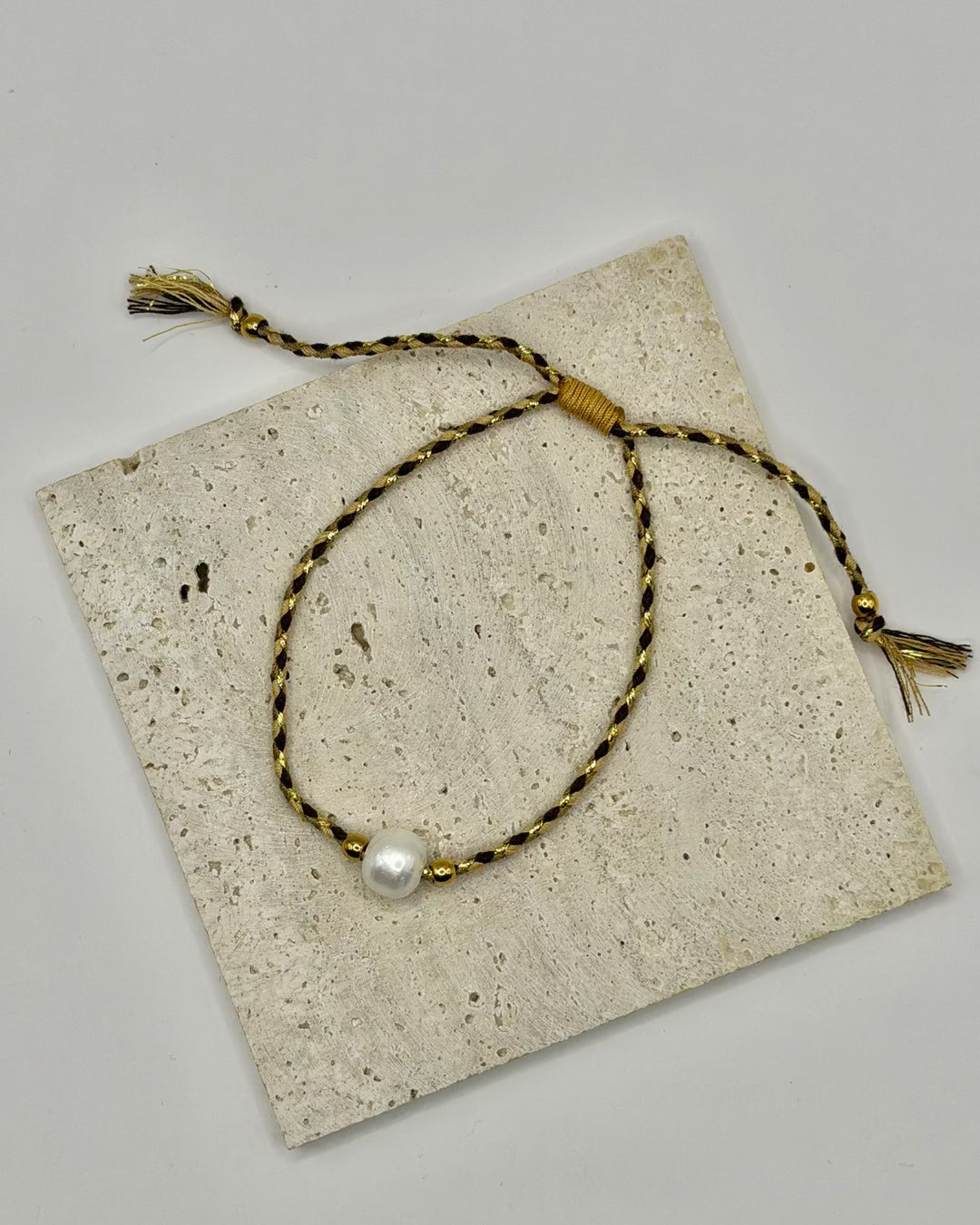 Freshwater Pearl Cord Bracelet worn on the wrist, adjustable cotton cord design