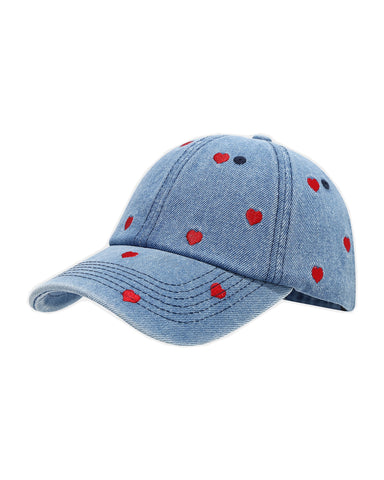 Mid-wash denim baseball cap embroidered with small red hearts, front view on a white background.