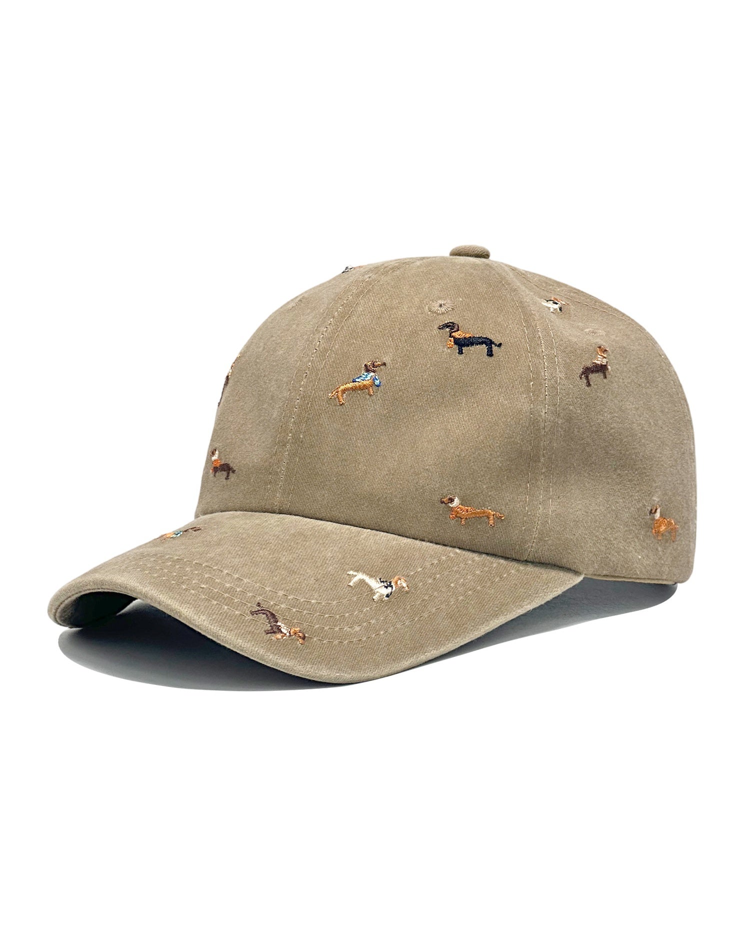 Beige denim baseball cap embroidered with colourful dachshund dogs, front view on a white background.
