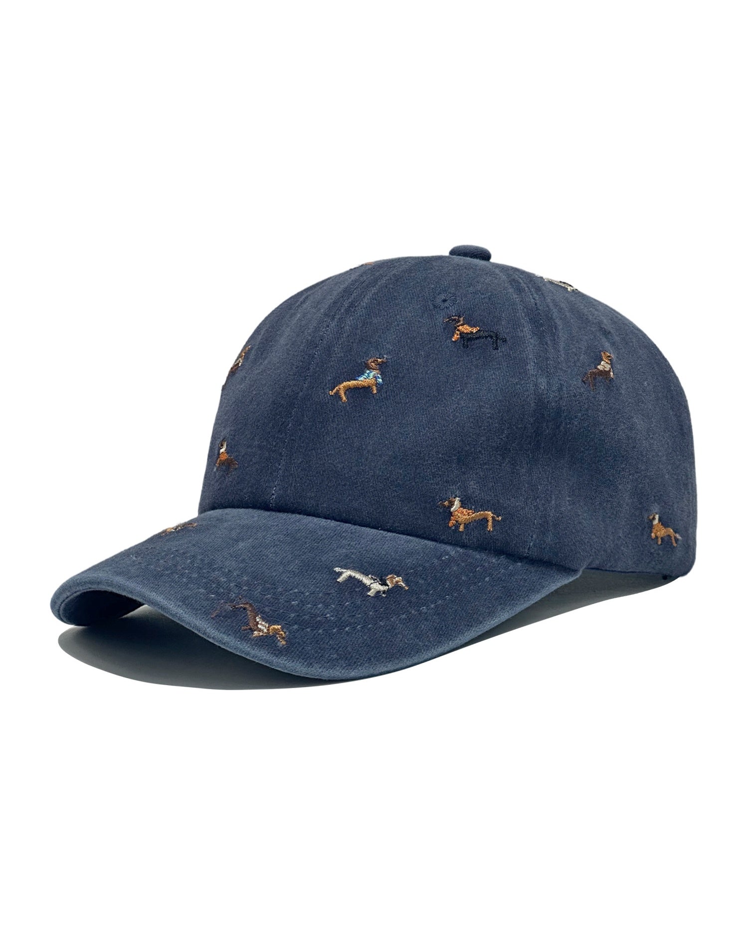Navy denim baseball cap embroidered with colourful dachshund dogs, front view on a white background.