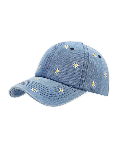 Mid-wash denim baseball cap embroidered with white and yellow daisies, front view on a white background.