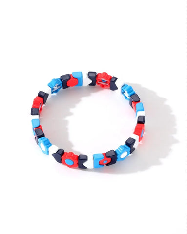 Colorful bracelet with red, blue, and black beads on a white background