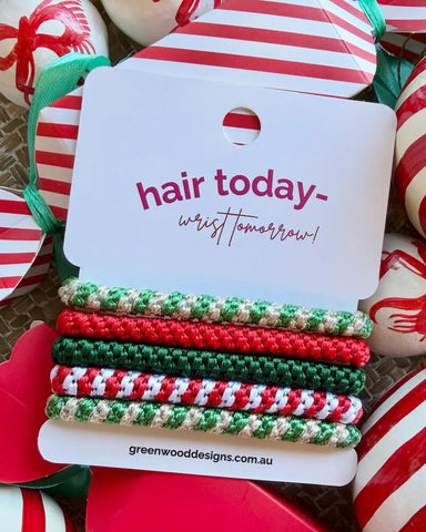Jingle Belles Christmas hair elastics by Greenwood Designs, set of five colourful hair ties in red, green and gold, perfect for festive styling and Christmas gifts.