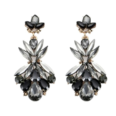 A pair of dangle earrings featuring black and grey crystals arranged in a chandelier style.