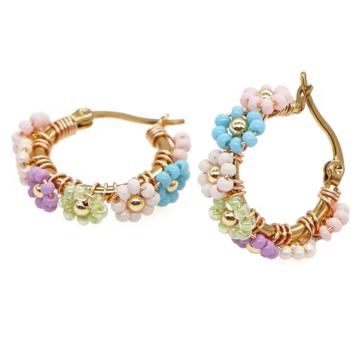 Pastel coloured beaded flower gold plated hoop earrings on white background