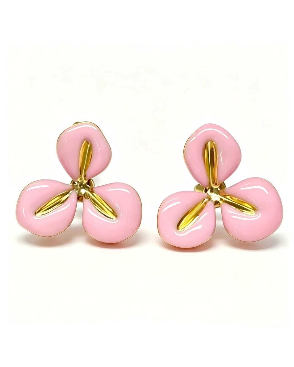 Gold stud earrings with a baby pink enamel three-petal flower design