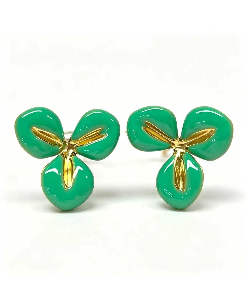 Gold stud earrings with a green enamel three-petal flower design
