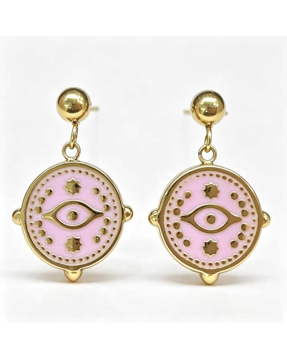 Gold stud earrings with a baby pink enamel evil eye charm dangle