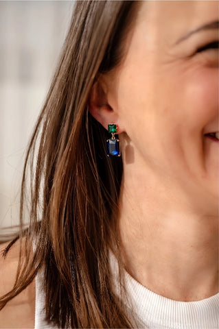 Pippa Emerald and Navy Rectangle Crystal Statement Dangle Earrings featuring an emerald green square crystal stud top and deep navy blue rectangle crystal drop in a gold-toned prong setting, 4.5x1.8cm.