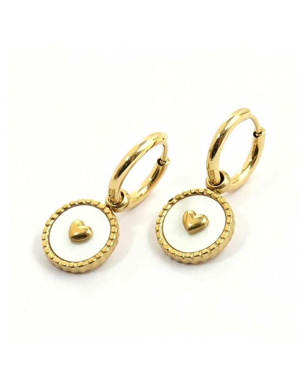 Gold hoop earrings with a white enamel heart charm medallion dangle