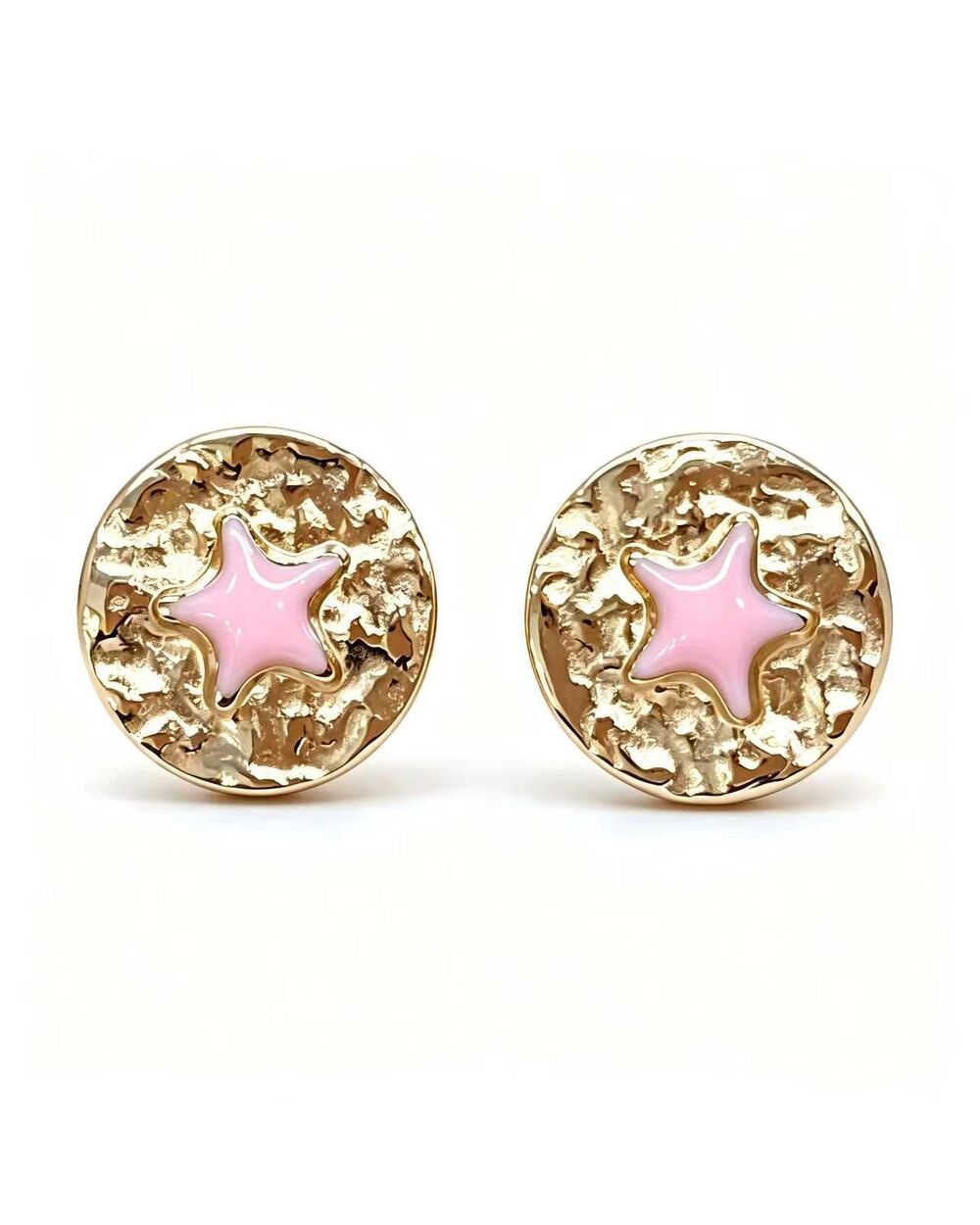 Gold stud earrings with a pink enamel star at the centre