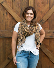 Elevate your style with our lightweight beige and black cheetah pattern scarf, perfect for all seasons. The bold cheetah print adds an edgy touch to any outfit, complemented by the neutral beige and black color combination that pairs effortlessly with various styles. Playful tassels on each end provide a fun accent, and the generous 185 x 90cm size allows for versatile styling options.