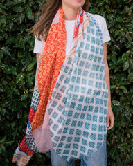 Elevate your style with our abstract scarf showcasing a stunning mosaic-like pattern in vibrant reds, corals, blues, and greens. Frayed edges add texture and a relaxed vibe to the unique design. Lightweight and versatile, this scarf is the perfect accessory for adding a pop of color to any outfit. Crafted from a comfortable polyester blend.