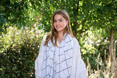 Elevate your style with our white base black check scarf, a perfect all-season accessory. Its lightweight fabric makes it versatile for year-round wear, ideal for layering on cool days or adding sophistication to your outfit. The crisp white base complements bold black checks, creating a versatile and stylish accessory suitable for both casual and formal occasions. A must-have for any wardrobe.