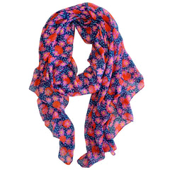 This scarf features a playful and feminine design, with pink flowers set against a speckled mint green and navy background. The bold red polka dots add a fun and lively touch to the design, while the colourful floral accents bring a touch of romance and elegance. Made from a lightweight material, this scarf is perfect for wearing all year round, and the generous size allows for multiple styling options.