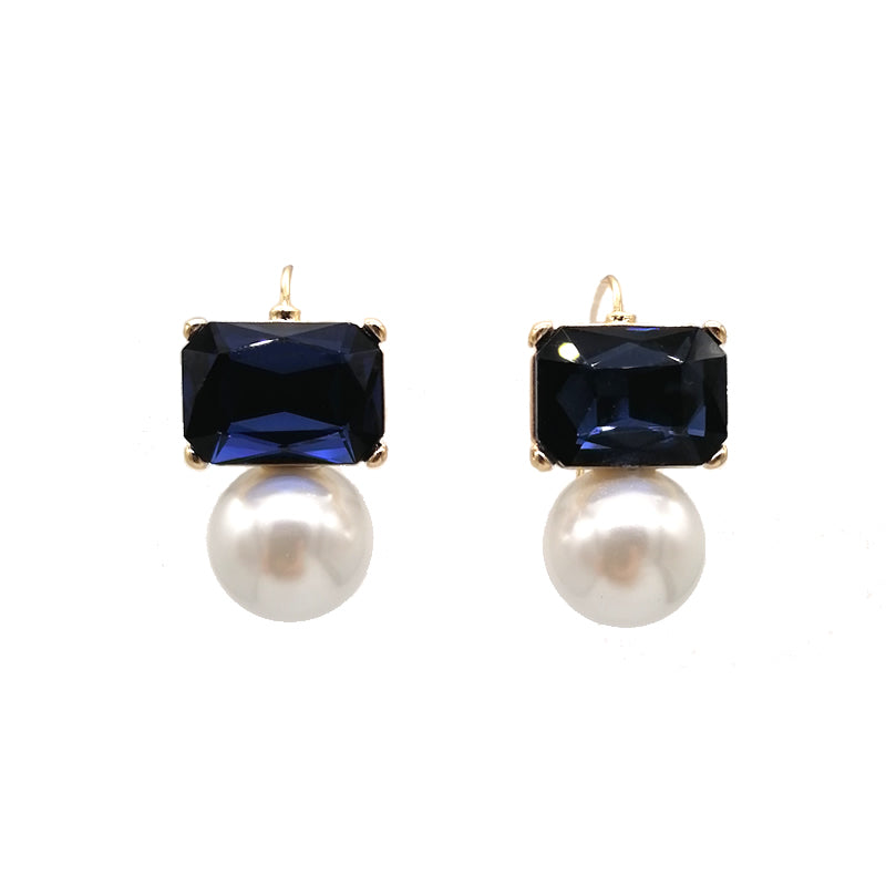 A pair of earrings featuring navy rectangular crystals with faux pearls, set in gold-plated settings.