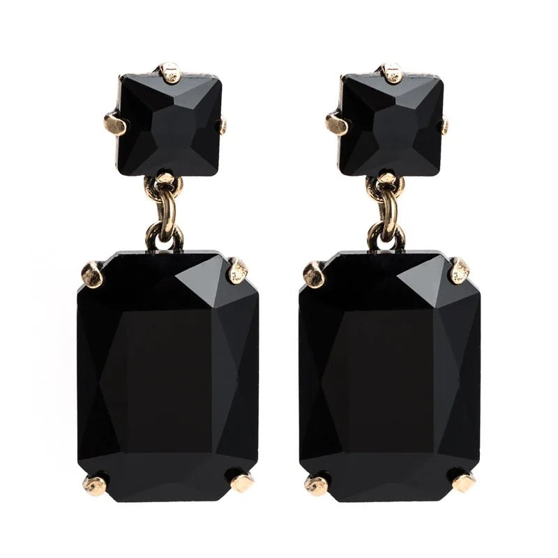 Pippa Black Rectangle Crystal Dangle Earrings featuring bold black gemstones in a gold-toned setting, dangling gracefully from surgical steel posts, 4.5x1.8cm.