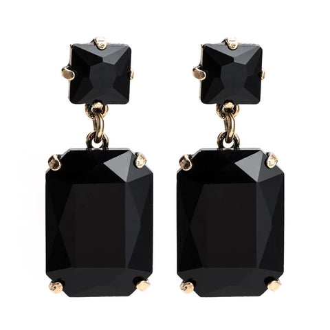 Pippa Black Rectangle Crystal Dangle Earrings featuring bold black gemstones in a gold-toned setting, dangling gracefully from surgical steel posts, 4.5x1.8cm.