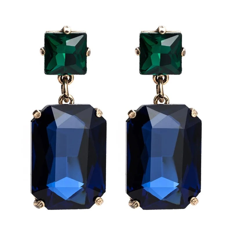 Pippa Emerald and Navy Rectangle Crystal Statement Dangle Earrings featuring an emerald green square crystal stud top and deep navy blue rectangle crystal drop in a gold-toned prong setting, 4.5x1.8cm.